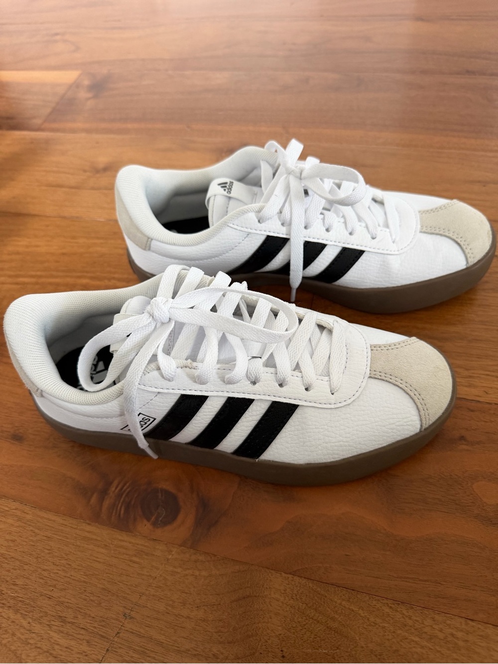 adidas Women’s White Sneakers with Black Stripes and Gum Sole